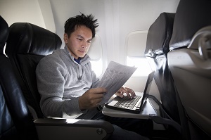 A young Asian male working on a plane
